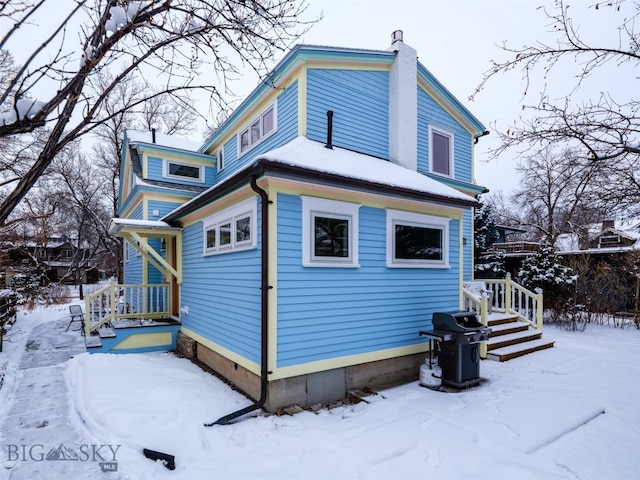 view of snow covered property