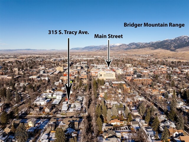 birds eye view of property with a mountain view