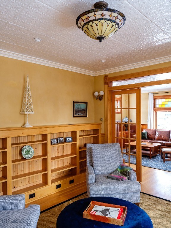 living room featuring crown molding