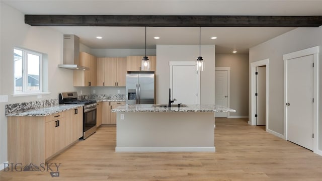 kitchen with wall chimney range hood, light brown cabinets, appliances with stainless steel finishes, and beam ceiling