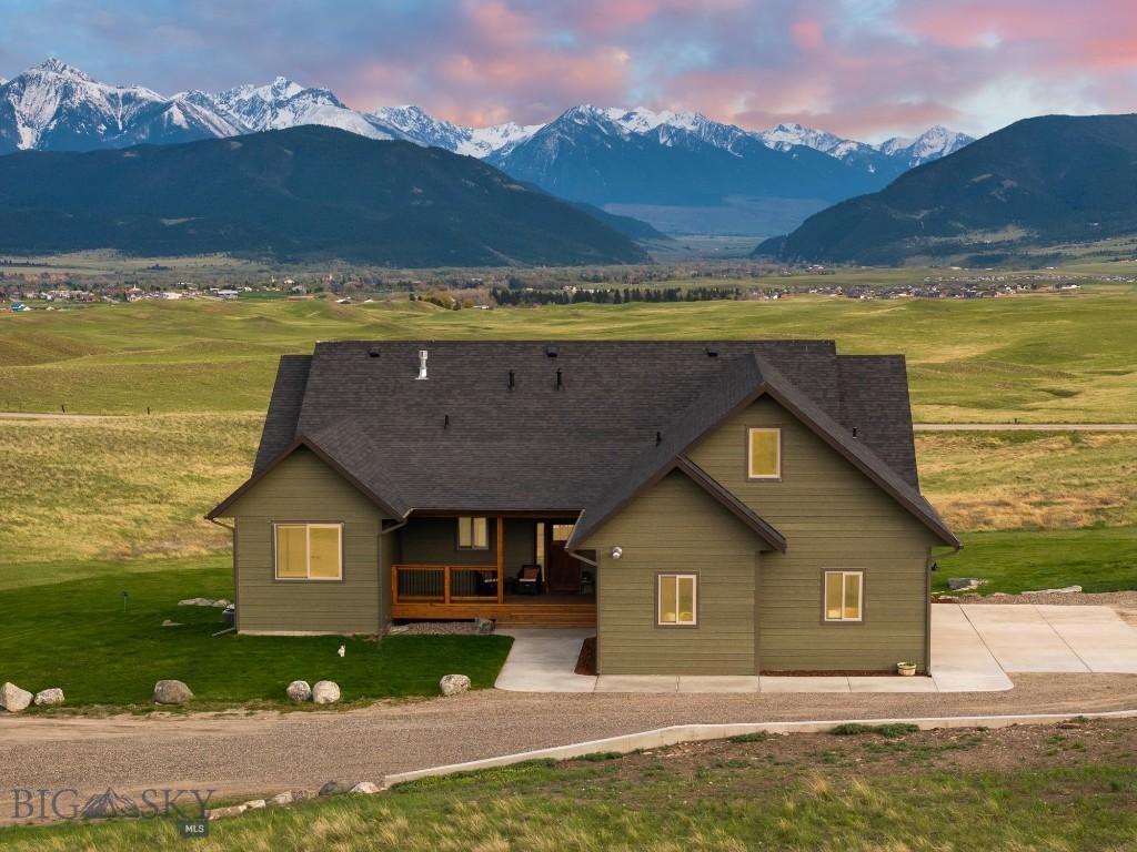 back house at dusk featuring a mountain view