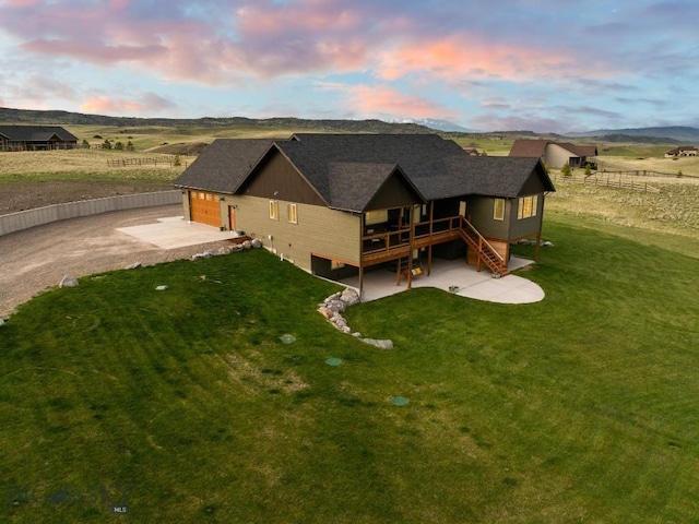 exterior space with a deck and a lawn