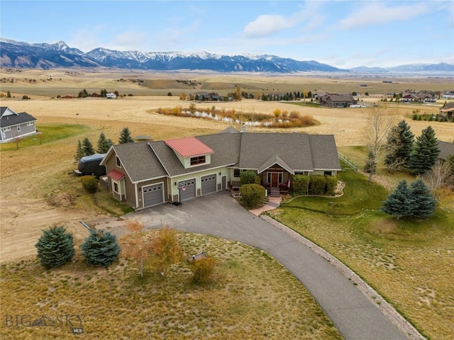 bird's eye view with a mountain view and a rural view