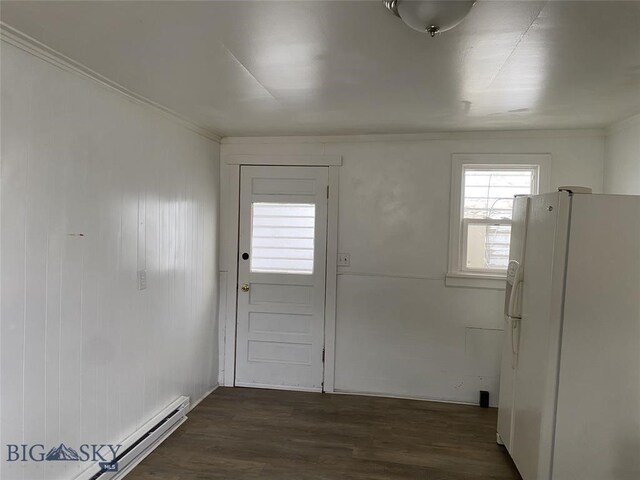 doorway with dark hardwood / wood-style flooring, crown molding, and a baseboard radiator