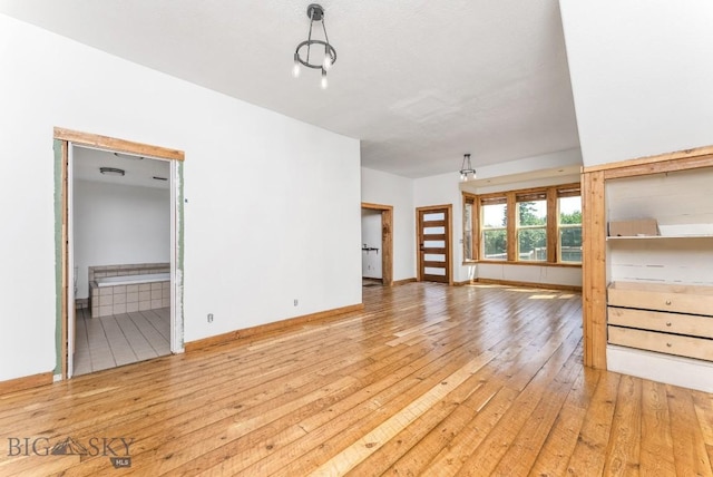 unfurnished living room with light hardwood / wood-style flooring