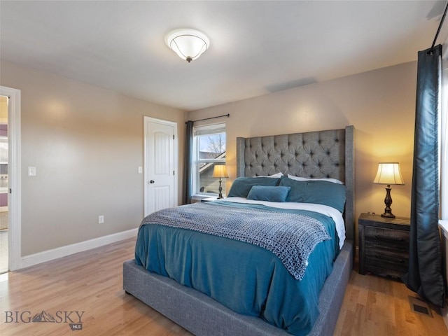 bedroom featuring hardwood / wood-style flooring