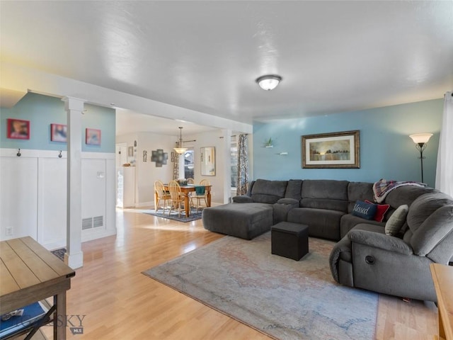 living room with light hardwood / wood-style flooring