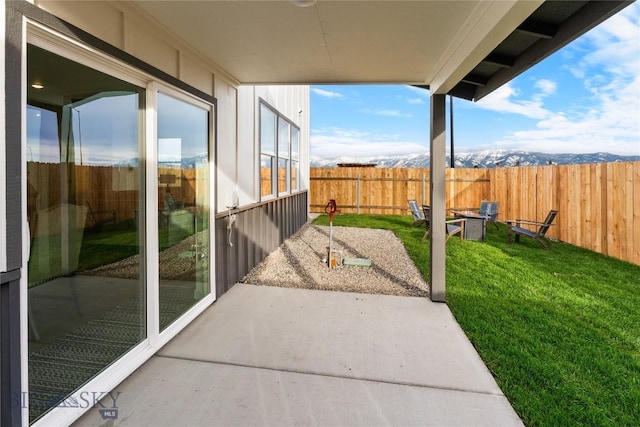 view of patio / terrace with a mountain view