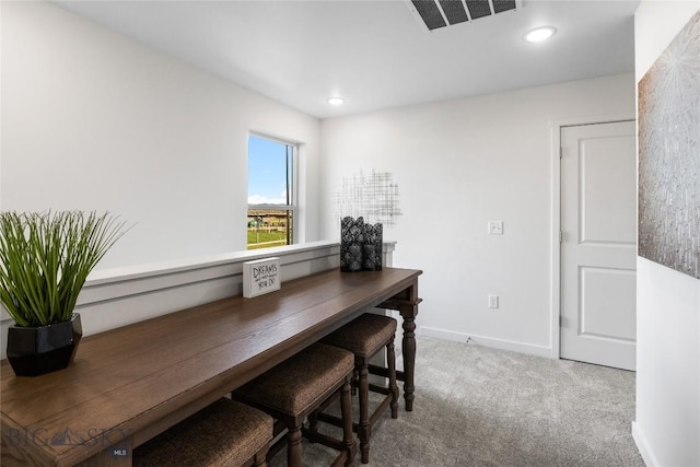 view of carpeted dining space