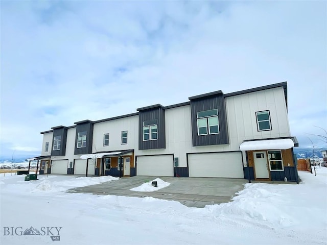 multi unit property featuring a garage