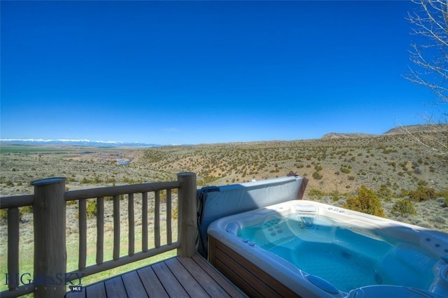 1061 Lookabout Ln, Manhattan, MT 59741 - deck featuring a hot tub, view of desert landscape, a mountain view, and a view of countryside
