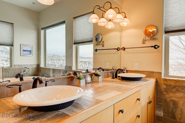 1061 Lookabout Ln, Manhattan, MT 59741 - full bathroom with healthy amount of natural light, double vanity, and a tub