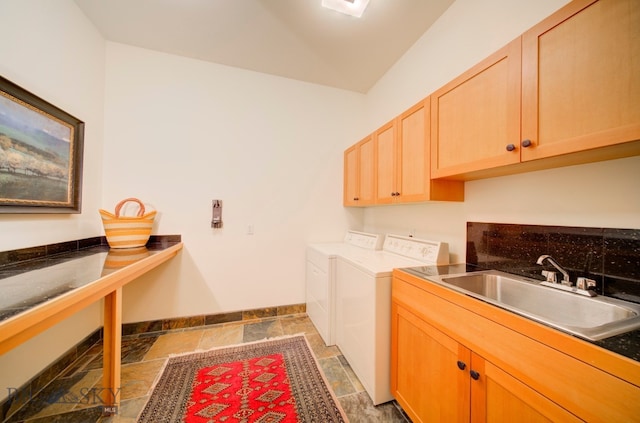 1061 Lookabout Ln, Manhattan, MT 59741 - laundry room featuring cabinet space, washing machine and dryer, and stone tile floors