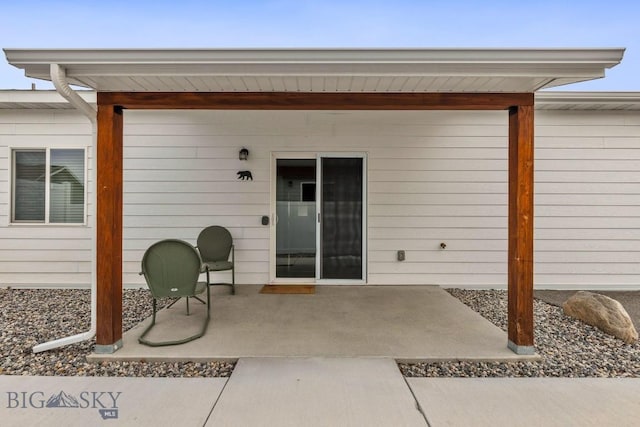 doorway to property with a patio area