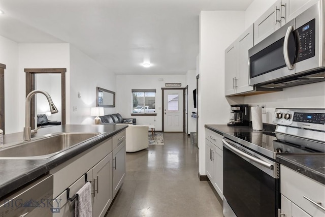 kitchen with white cabinets, sink, and stainless steel appliances