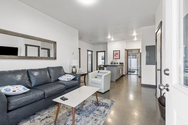 living room with electric panel and sink