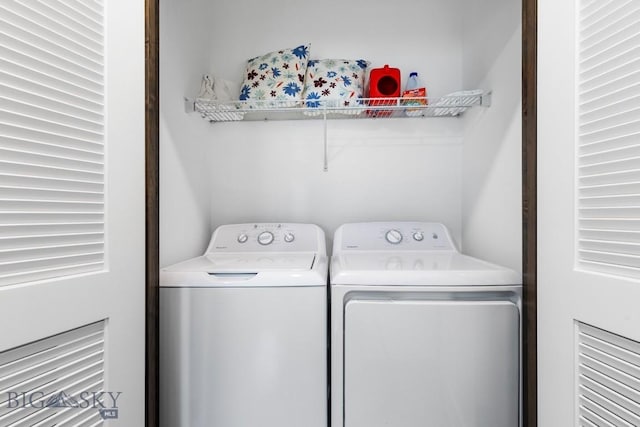 laundry area featuring washing machine and dryer