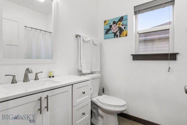 bathroom featuring vanity and toilet