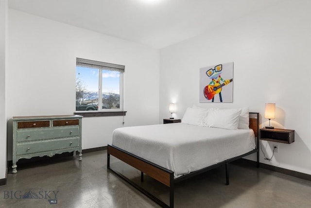 bedroom with concrete flooring