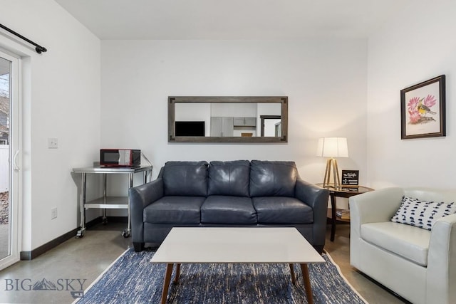 living room with concrete floors