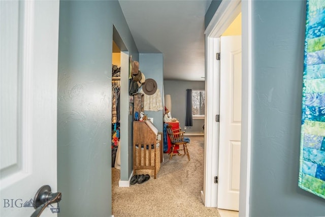 hallway with light colored carpet