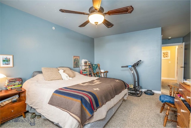 bedroom featuring ceiling fan and carpet