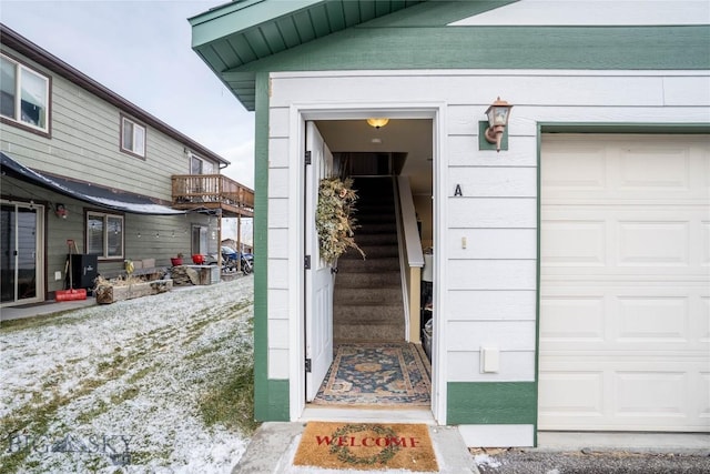 view of exterior entry with a garage