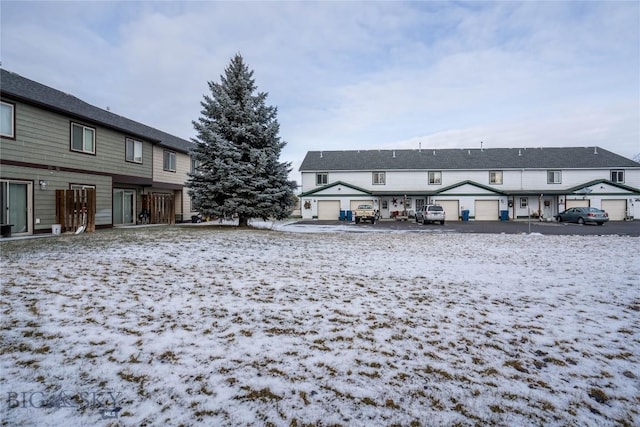 view of snow covered house