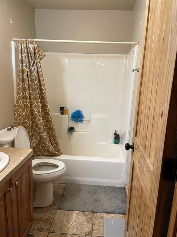 full bathroom with vanity, toilet, and shower / tub combo with curtain