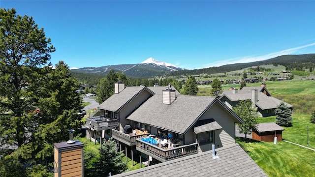 birds eye view of property with a mountain view