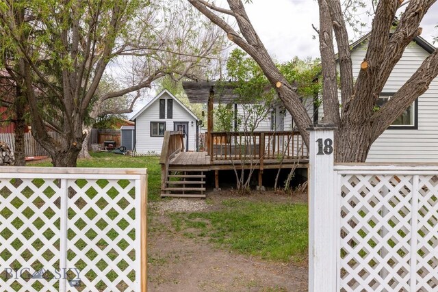 view of yard with a wooden deck