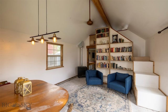 living area with lofted ceiling with beams