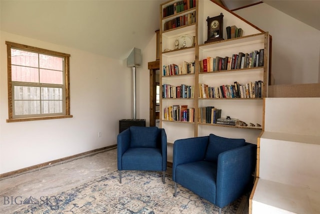 sitting room with lofted ceiling