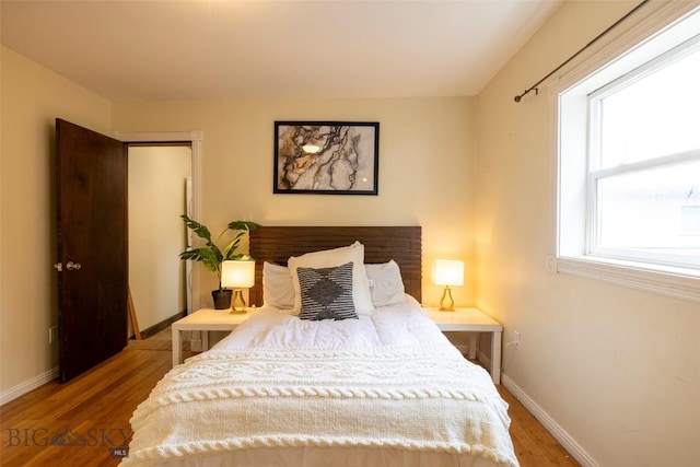 bedroom featuring wood-type flooring