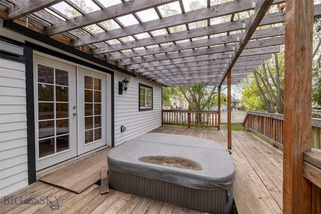 wooden deck with french doors and a pergola