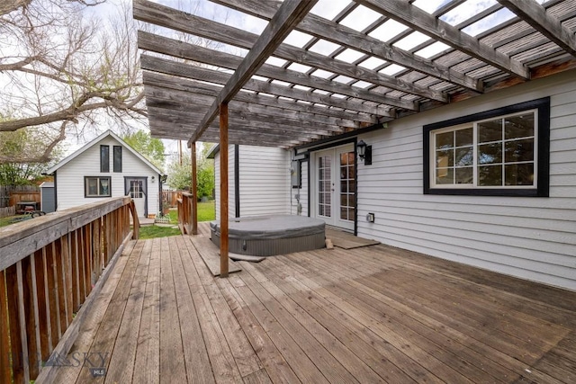 deck with a pergola and a hot tub