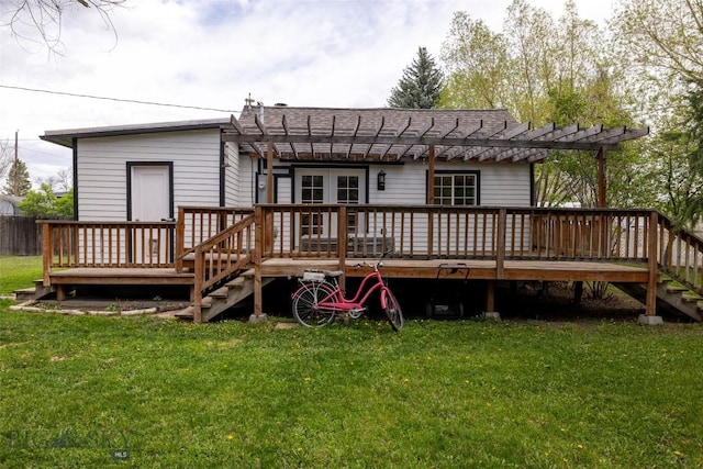 back of property featuring a yard, a pergola, and a deck