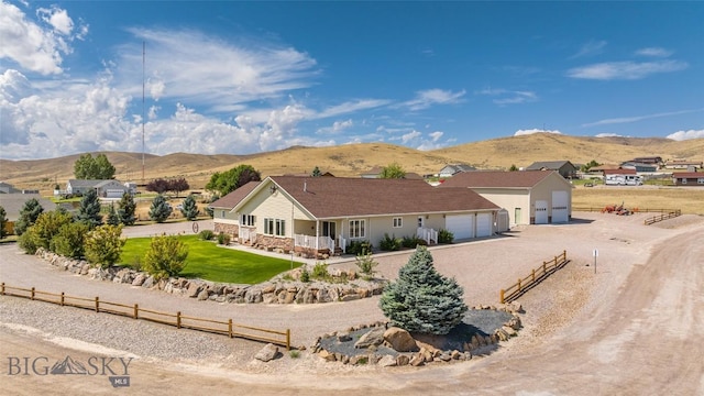 view of front of house featuring a mountain view and a garage