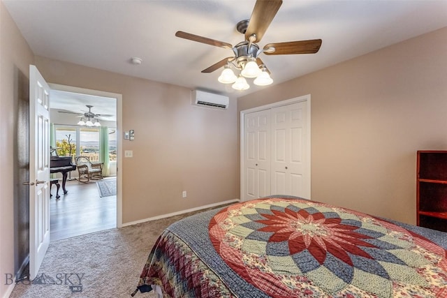 carpeted bedroom with a wall unit AC, ceiling fan, and a closet