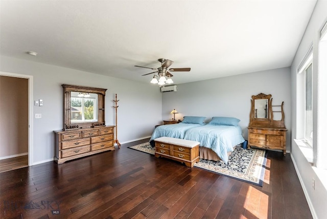 bedroom with ceiling fan, dark hardwood / wood-style floors, and a wall mounted AC