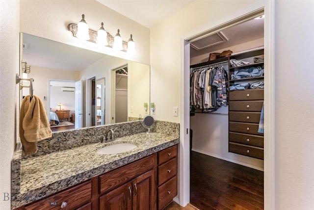 bathroom featuring vanity and wood-type flooring