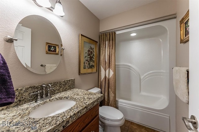 full bathroom with tile patterned flooring, vanity, toilet, and shower / bath combo with shower curtain