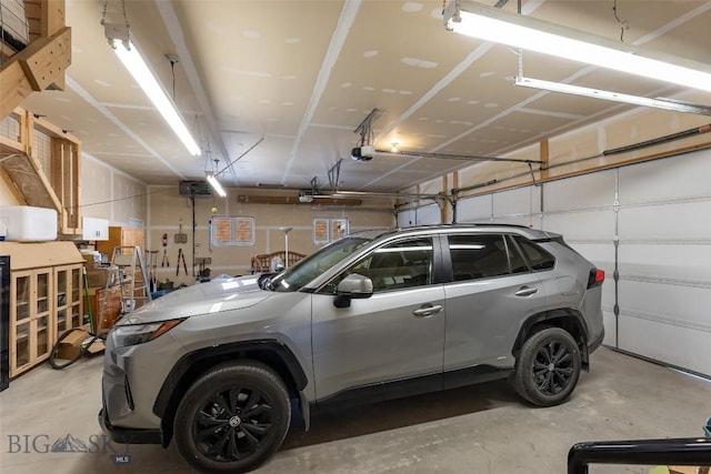 garage featuring a garage door opener