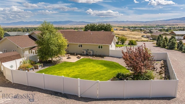 birds eye view of property featuring a mountain view