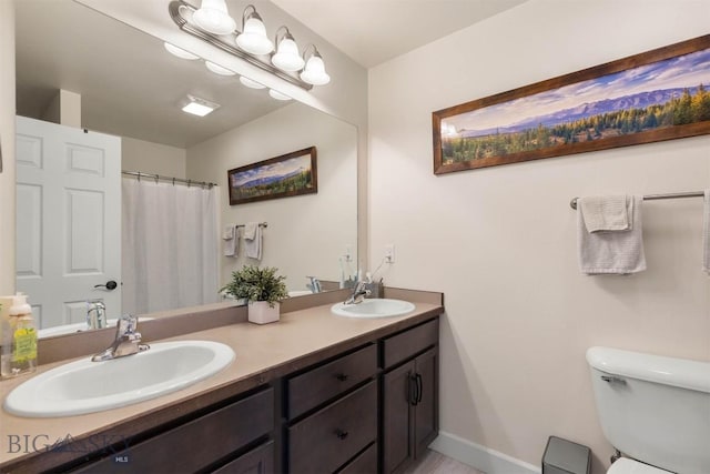 bathroom with vanity and toilet