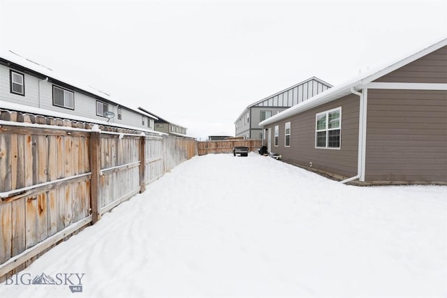 view of yard covered in snow