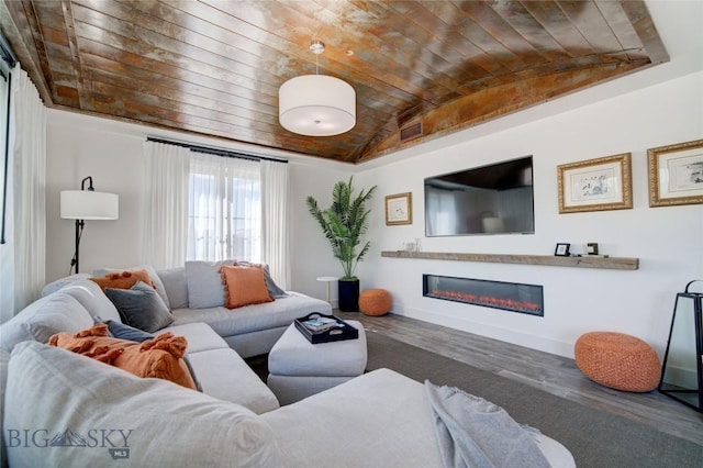 living room with wood-type flooring, lofted ceiling, and brick ceiling