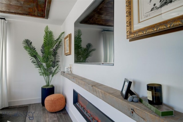 hallway with hardwood / wood-style flooring