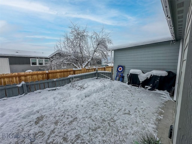 view of yard covered in snow