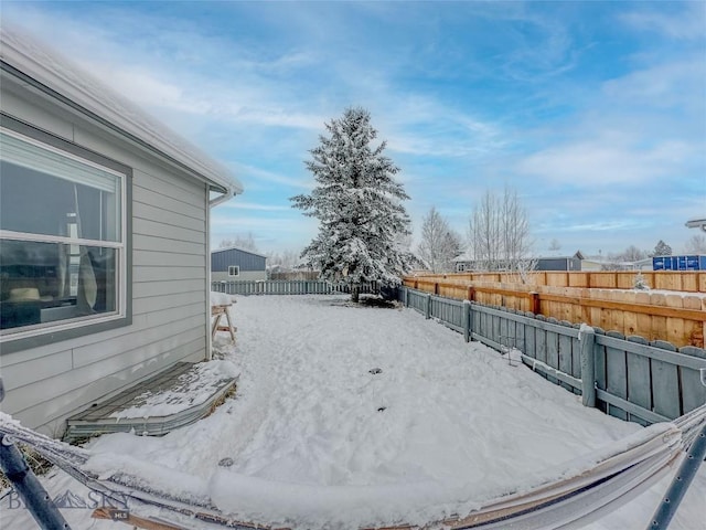 view of yard layered in snow